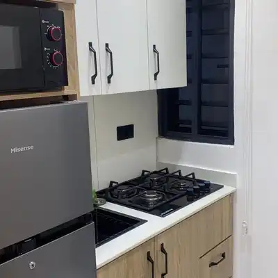 Kitchen with cooker and worktop